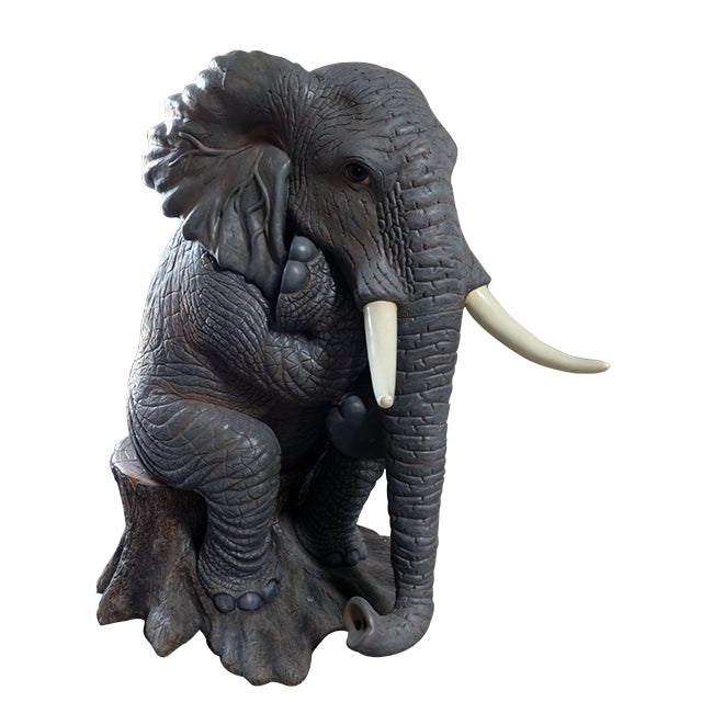 Elephant Sitting On Tree Statue