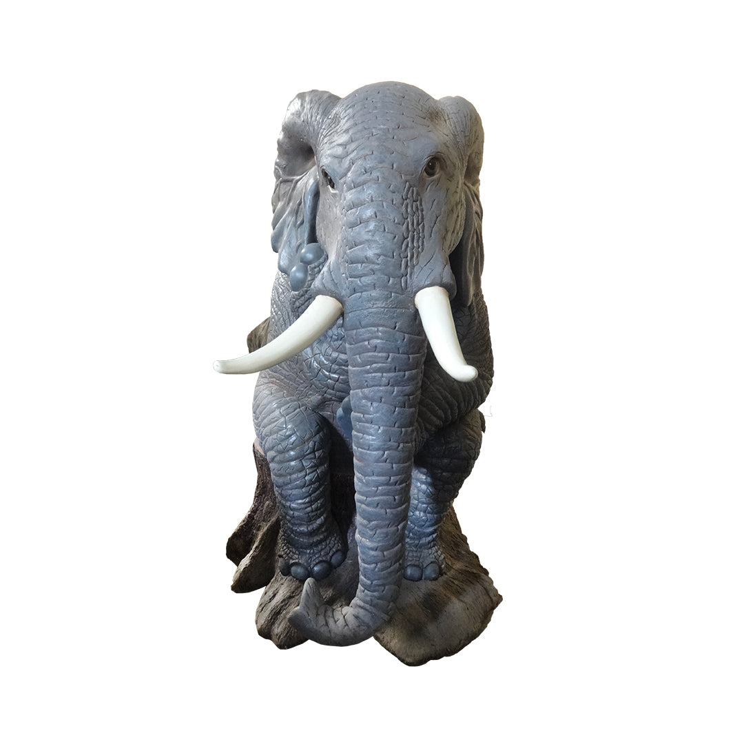 Elephant Sitting On Tree Statue