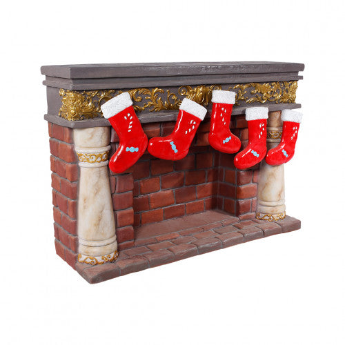 Fireplace With Stocking Over Sized Statue