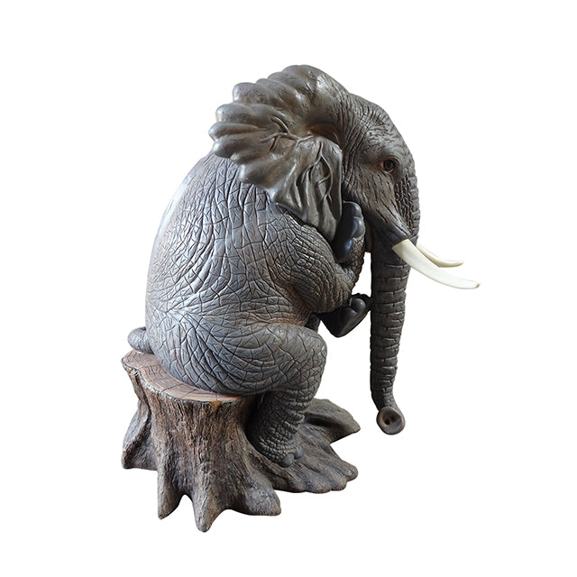 Elephant Sitting On Tree Statue
